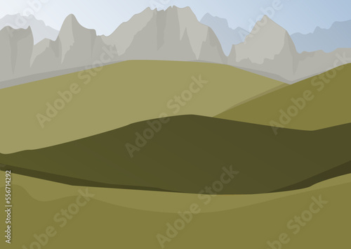 Green gentle hills and sharp gray mountains