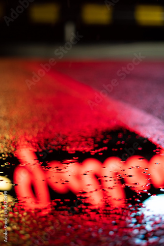 Photography Closeup shot of reflection of city lights in a puddle after the rain
