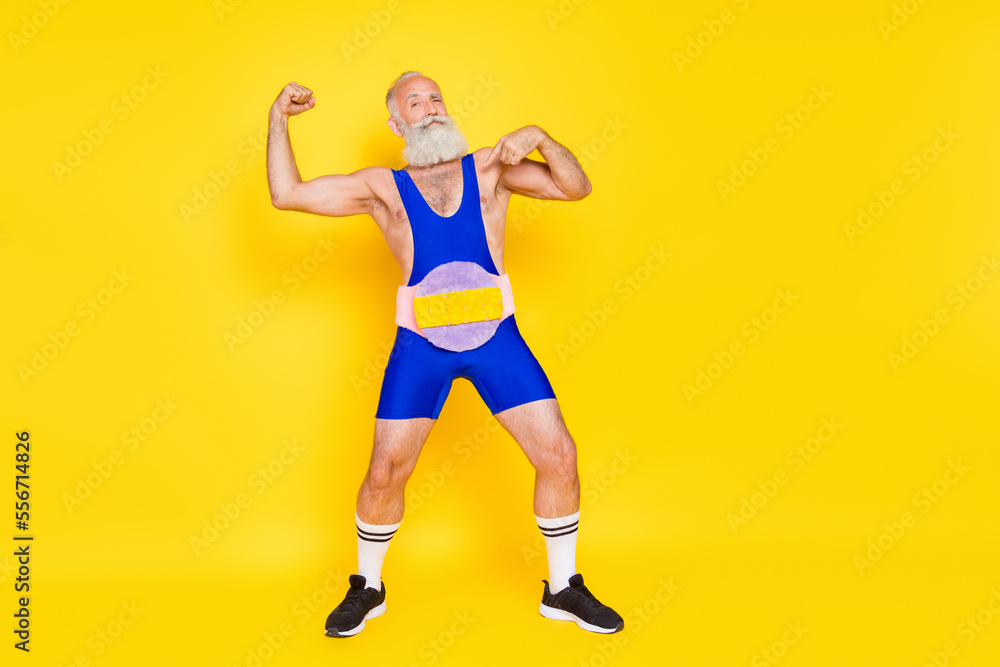 Full length portrait of confident grandfather point finger himself show biceps wear fluffy soft belt isolated on yellow color background Full length portrait of confident grandfather point finger himself show biceps wear fluffy soft belt isolated on yellow color background