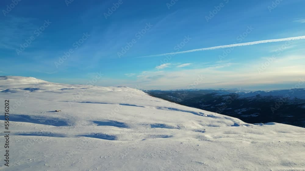 A beautiful view of snowy mountains in Norway. Panoramic view of mountain peaks 1100 meters above sea level. A clear blue sky on a cold winter day. A beautiful view of snowy mountains in Norway. Panoramic view of mountain peaks 1100 meters above sea level. A clear blue sky on a cold winter day.