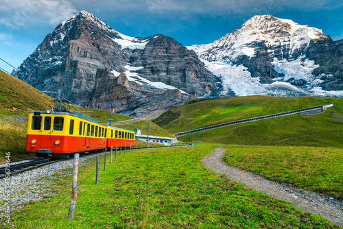 Electric tourist train and snowy Eiger mountain, Bernese Oberland, Switzerland © janoka82