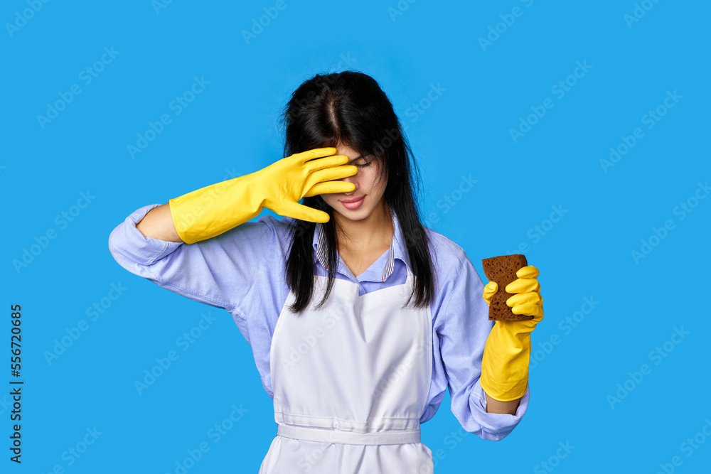 woman in gloves and cleaner apron with sponge woman in gloves and cleaner apron with sponge