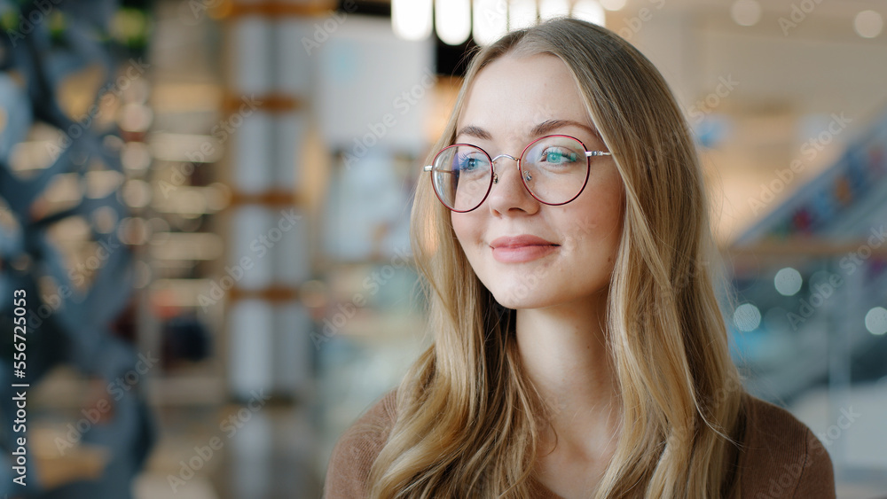Head shot portrait Caucasian lady female girl in glasses pensive woman looking away ophthalmology services millennial blonde model with healthy eyesight good vision indoors think pondering thinking - obrazy, fototapety, plakaty 