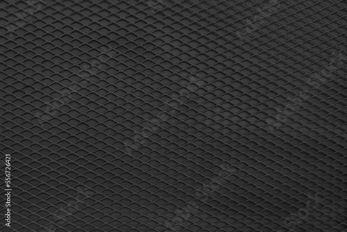 Steel black protective grille with mesh background texture and pattern. Industrial corrugated rough iron surface