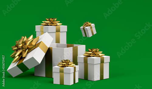 Gift boxes with ribbon and bow for Merry Christmas flying and falling on green