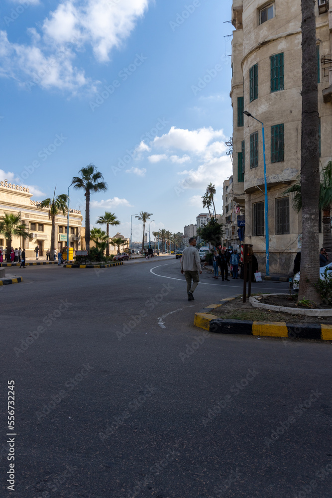 Streets of the city of Alexandria, with people walking around, on a sunny day.