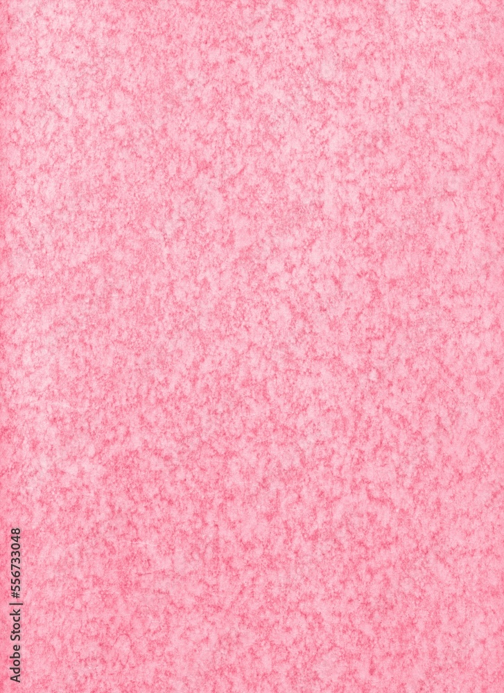 An old mottled cardboard colored in pink as an abstract background An old mottled cardboard colored in pink as an abstract background