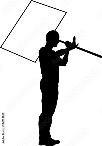 Protestor or demonstrator at a demonstration march, picket line or strike protest rally in silhouette. Holding up a banner or picket sign board placard.