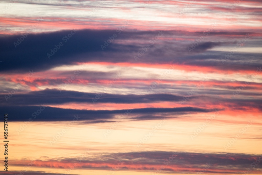 Beautiful evening sky with orange, grey, yellow clouds after the sunset, like an abstract painting Beautiful evening sky with orange, grey, yellow clouds after the sunset, like an abstract painting