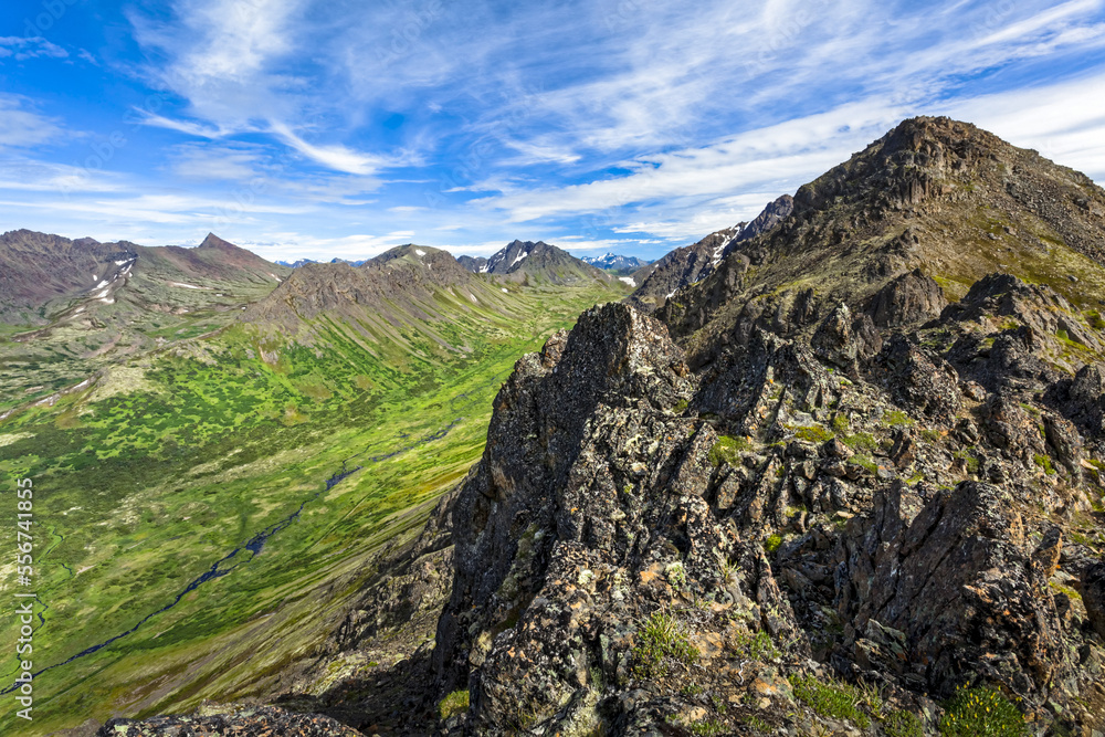 Ptarmigan Peak under blue sky, Campbell Creek and valley down below, Chugach State Park, South-central Alaska in summertime; Anchorage, Alaska, United States of America Ptarmigan Peak under blue sky, Campbell Creek and valley down below, Chugach State Park, South-central Alaska in summertime; Anchorage, Alaska, United States of America