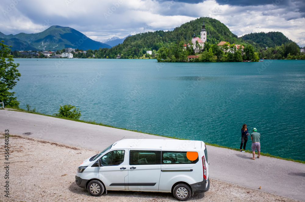 Travelers stop their camper van to take a photo of the Church on an ...