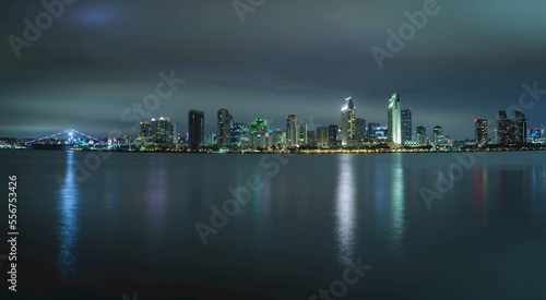 San Diego skyline illuminated at night with reflections on the Bay; San Diego, California, United States of America photo