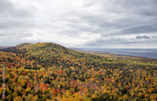 Panoramic view of vibrant autumn colours covering Oberg Mountain along Superior Hiking Trail Oberg Mountain Loop with a view of Lake Superior; Tofte, Minnesota, United States of America photo