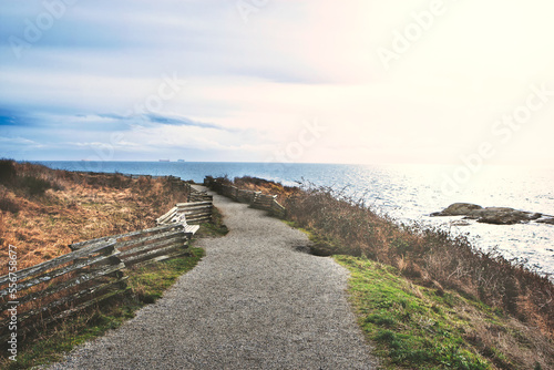 Scenic Path Trail in a Park by the Coastline. MacAulay Point Park in Victoria, Vancouver Island, British Columbia, Canada.