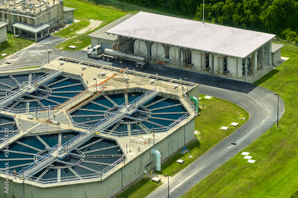 Obraz premium Aerial view of modern water cleaning facility at urban wastewater treatment plant. Purification process of removing undesirable chemicals, suspended solids and gases from contaminated liquid