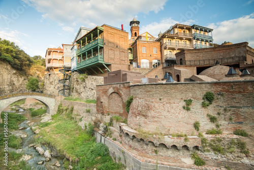 Old buildings built on the cliffs of Tbilisi's old town in the country of Georgia photo