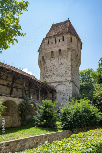 Tower along the stone wall of the medieval, fortified city of Sighisoara on the Tarnava River in Mures County; Sighisoara, Transylvania, Romania photo