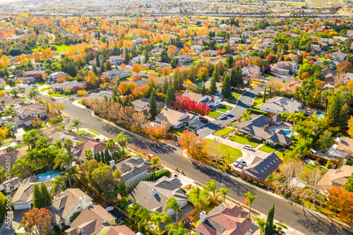 Drone photo over a community in California with beautiful fall colors and houses