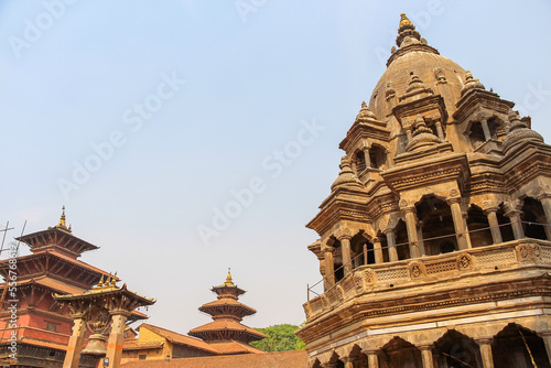 Chyasi Deval Krishna and Taleju hindu temples on Patan Durbar Square in a sunny day in Lalitpur city, Nepal. Religious architecture. Copy space for your text. Travel in asia theme. photo