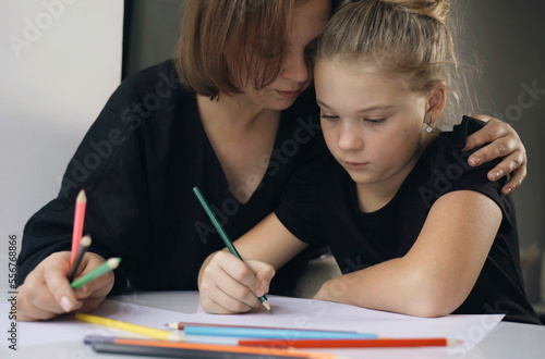 Wallpaper Mural Mom and daughter draw together, mom hugs her daughter. Torontodigital.ca