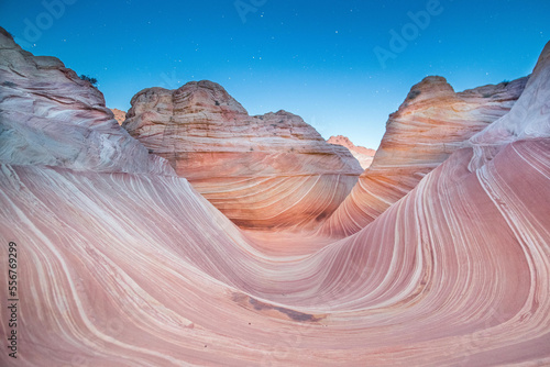 Nighttime stars above the Wave sandstone rock formation, located in Coyote Buttes North, Paria Canyon, Vermillion Cliffs Wilderness. photo