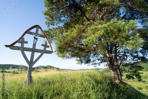 Christian cross on a hilltop in the medieval Saxon village of Copsa Mare, Romania; Transylvania, Romania photo