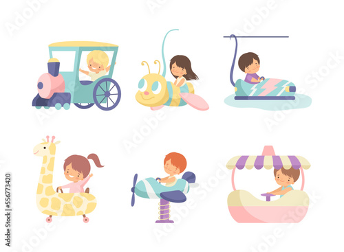 Cute kids having fun at attractions amusement park set cartoon vector illustration