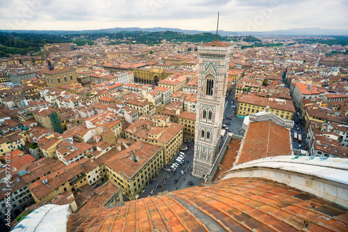 View of the Campanile (bell tower) and Florence cityscape from the Cathedral dome; Florence, Italy photo