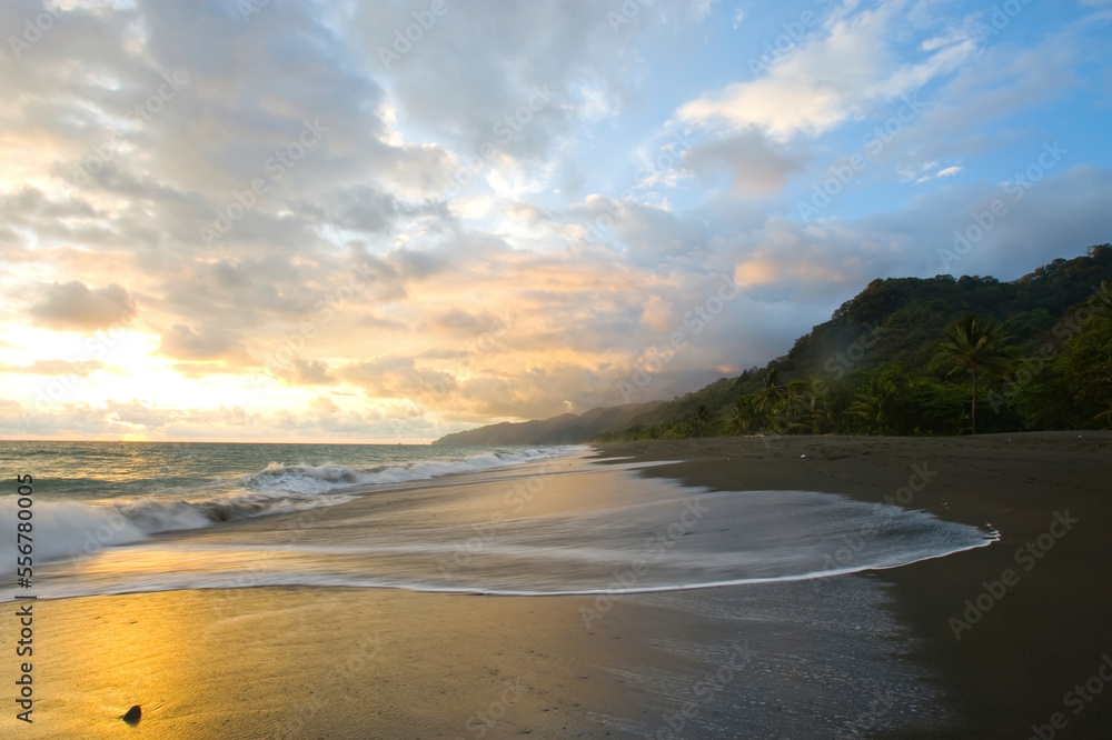 The tide rises at sunset on a remote beach in Costa Rica The tide rises at sunset on a remote beach in Costa Rica