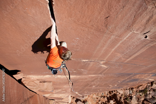 A climber traditionally climbs 'Desert Moon,' a 5.11 on the Catwall. photo
