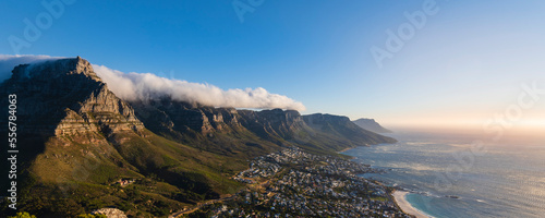 View of Cape Town Skyline and Camps Bay with clouds over the Twelve Apostles Mountains, South Africa