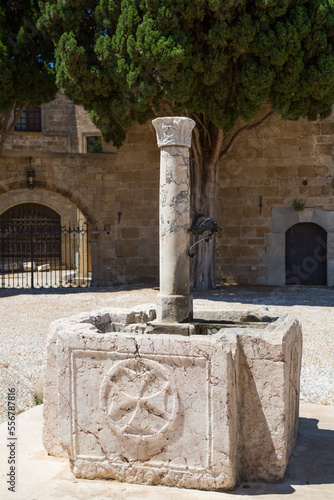 Close-up of the old baptismal fountain in Argyrokastro Square, Rhodes Old Town, Rhodes; Dodecanese Island Group, Greece photo