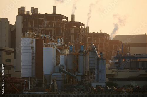 A coal-fired power station at sunset, Lamma Island, Hong Kong.; Yung Shue Wan, Lamma Island, Hong Kong, China. photo