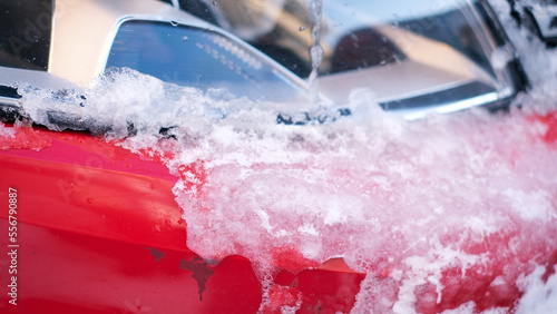 Close-up of snow frozen on a car. The concept of weather conditions © Viktoriia