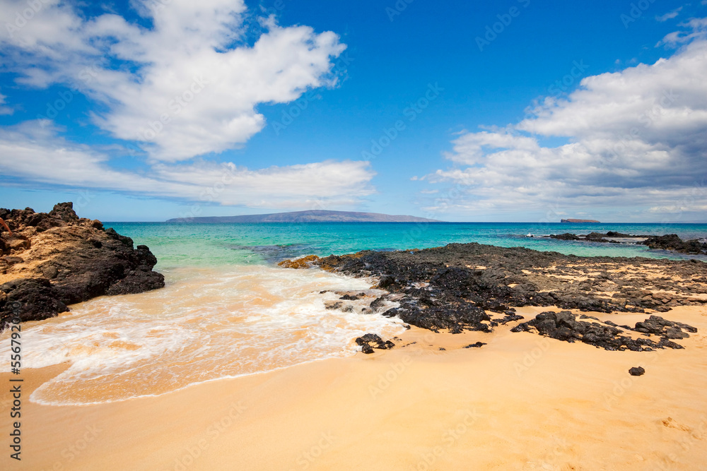 Secret Beach, also known as Secret Cove, Makena Cove, Wedding Beach and Paako Beach with Kahoolawe and Molokini in the distance; Makena, Maui, Hawaii, United States of America Secret Beach, also known as Secret Cove, Makena Cove, Wedding Beach and Paako Beach with Kahoolawe and Molokini in the distance; Makena, Maui, Hawaii, United States of America