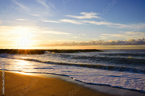 Fototapeta Naklejka Na Ścianę i Meble -  Beautiful sunset on the beach and sea with waves, Denmark