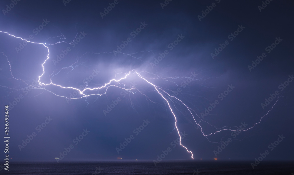 A spectacular lightning bolt hits the Rampion Offshore WIndfarm in the English Channel just off