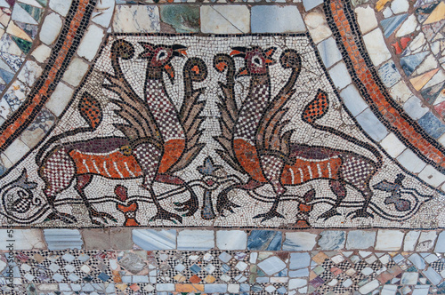 Mosaic floor in decorative patterns and symbols, San Pietro Martire Church on Murano Island; Venice, Veneto, Italy photo