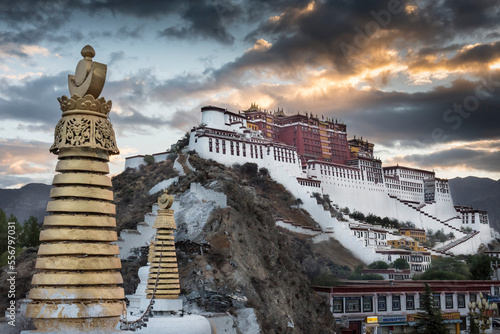 Potala Palace with stupas in foreground at sunrise; Lhasa, Tibetan Autonomous Region, Tibet photo