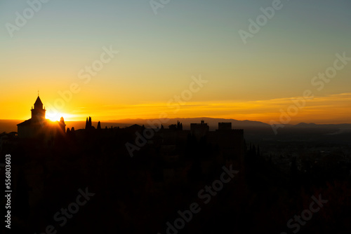 Sunset over ancieat arabic Alhambra in Granada, Spain on November 26, 2022 