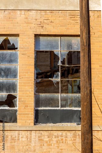 old broken window in a brick wall