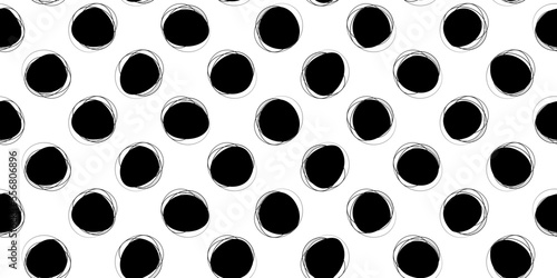 Black polka dots hand drawn with doodles. Vector print for seamless webs. Stylish illustration seamless for wallpaper and print surfaces. photo