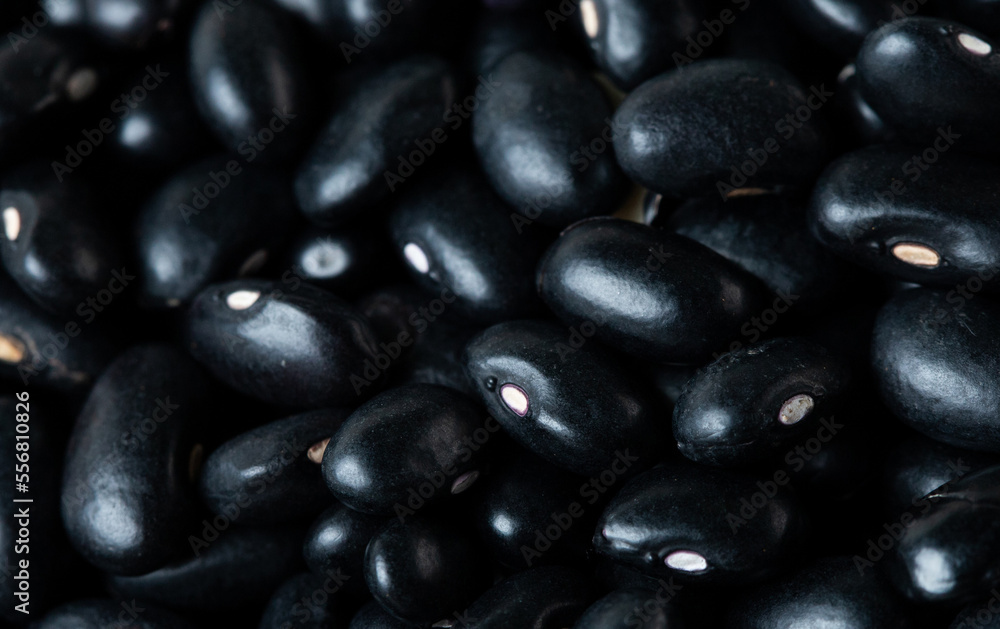 Macro Close up Texture of black bean, round grain beans. Beautiful complete seed pea bean, food object design. Selective focus freeze shot black background isolated Macro Close up Texture of black bean, round grain beans. Beautiful complete seed pea bean, food object design. Selective focus freeze shot black background isolated