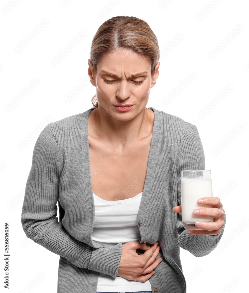Woman with glass of milk suffering from lactose intolerance on white background Woman with glass of milk suffering from lactose intolerance on white background