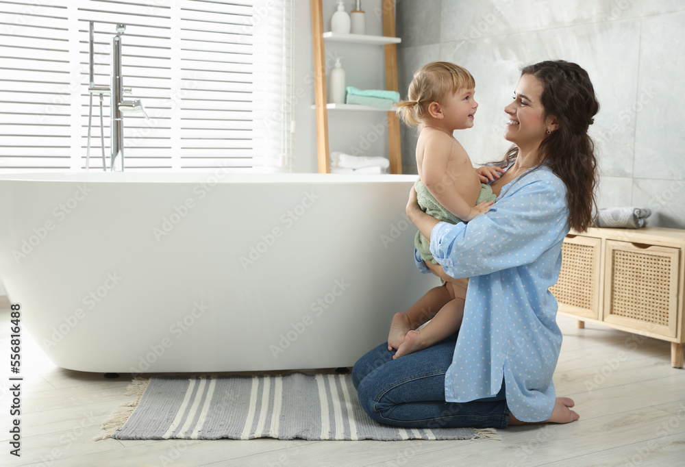 Mother with her daughter after bath at home Mother with her daughter after bath at home