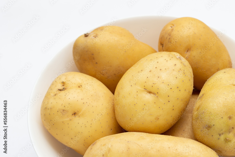 Raw potatoes isolated on white background Raw potatoes isolated on white background