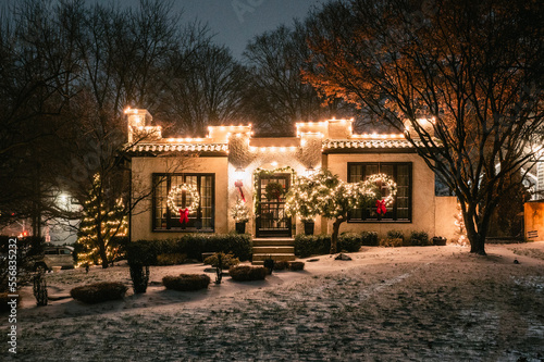 A house decorated for Christmas in a middle class neighborhood. photo