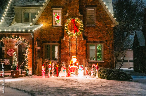 A house decorated for Christmas in a middle class neighborhood. photo