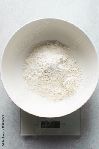 All purpose flour in a white bowl, baking flour in a large bowl 