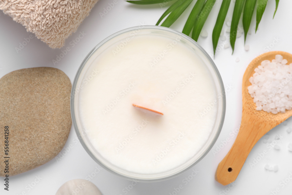 Flat lay composition with candle and different spa products on white background Flat lay composition with candle and different spa products on white background